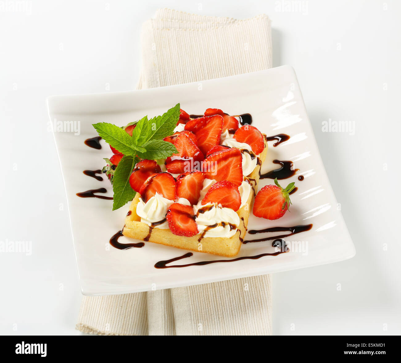 Belgian waffle with whipped cream and fresh strawberries Stock Photo ...