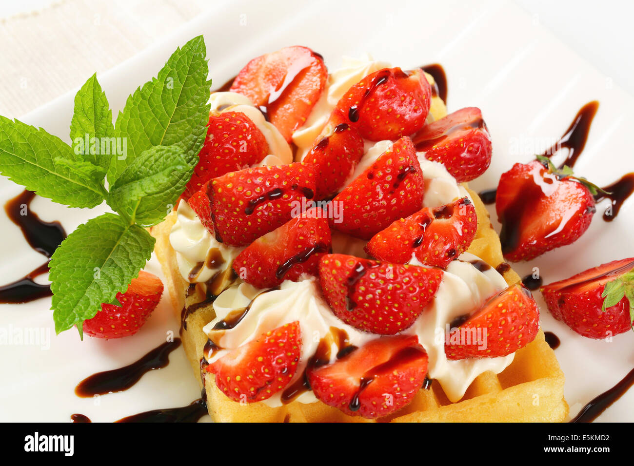 Belgian waffle with whipped cream and fresh strawberries Stock Photo ...