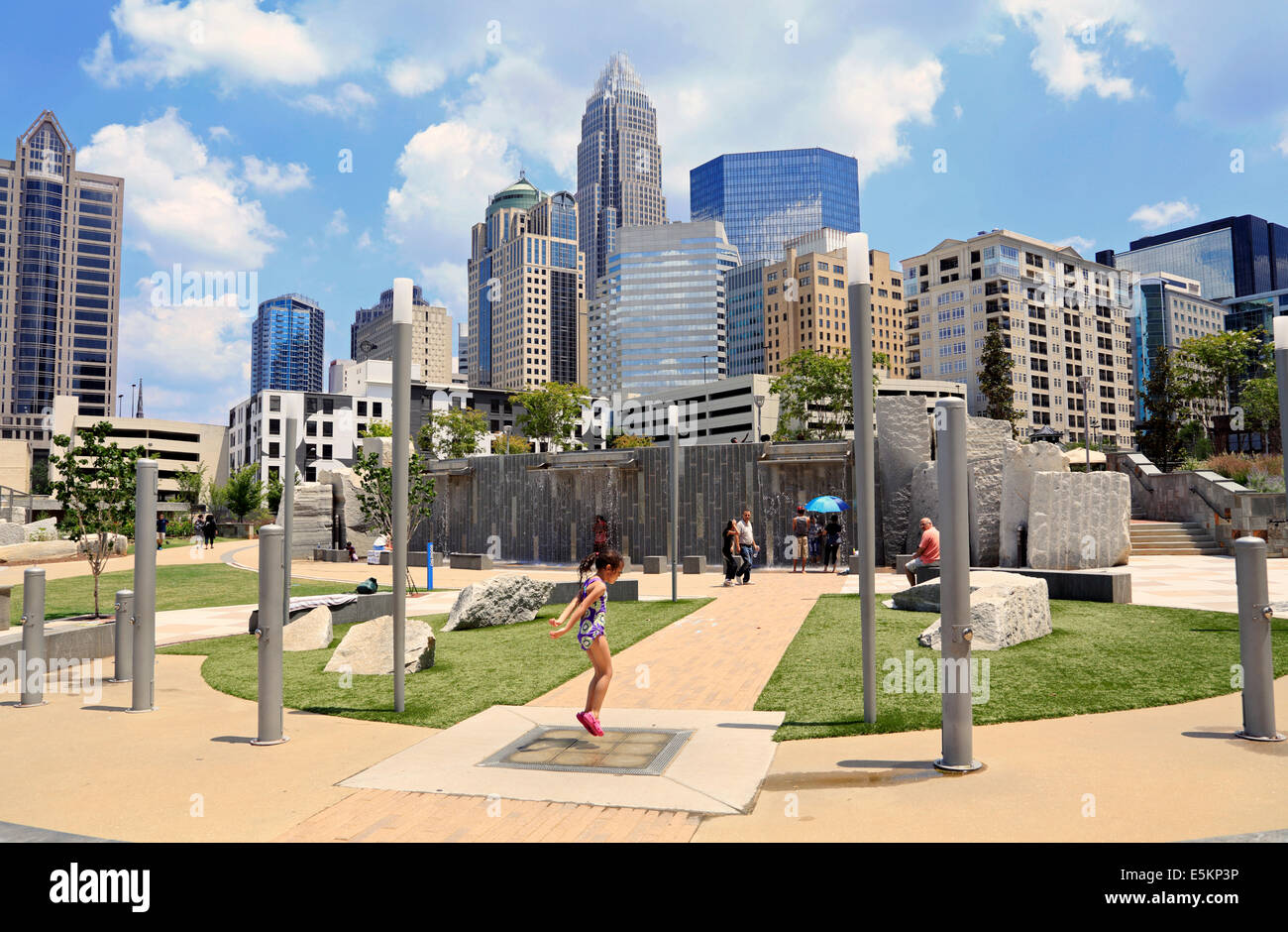 Charlotte, North Carolina. People in Romare Bearden Park with the skyline in the background. Stock Photo