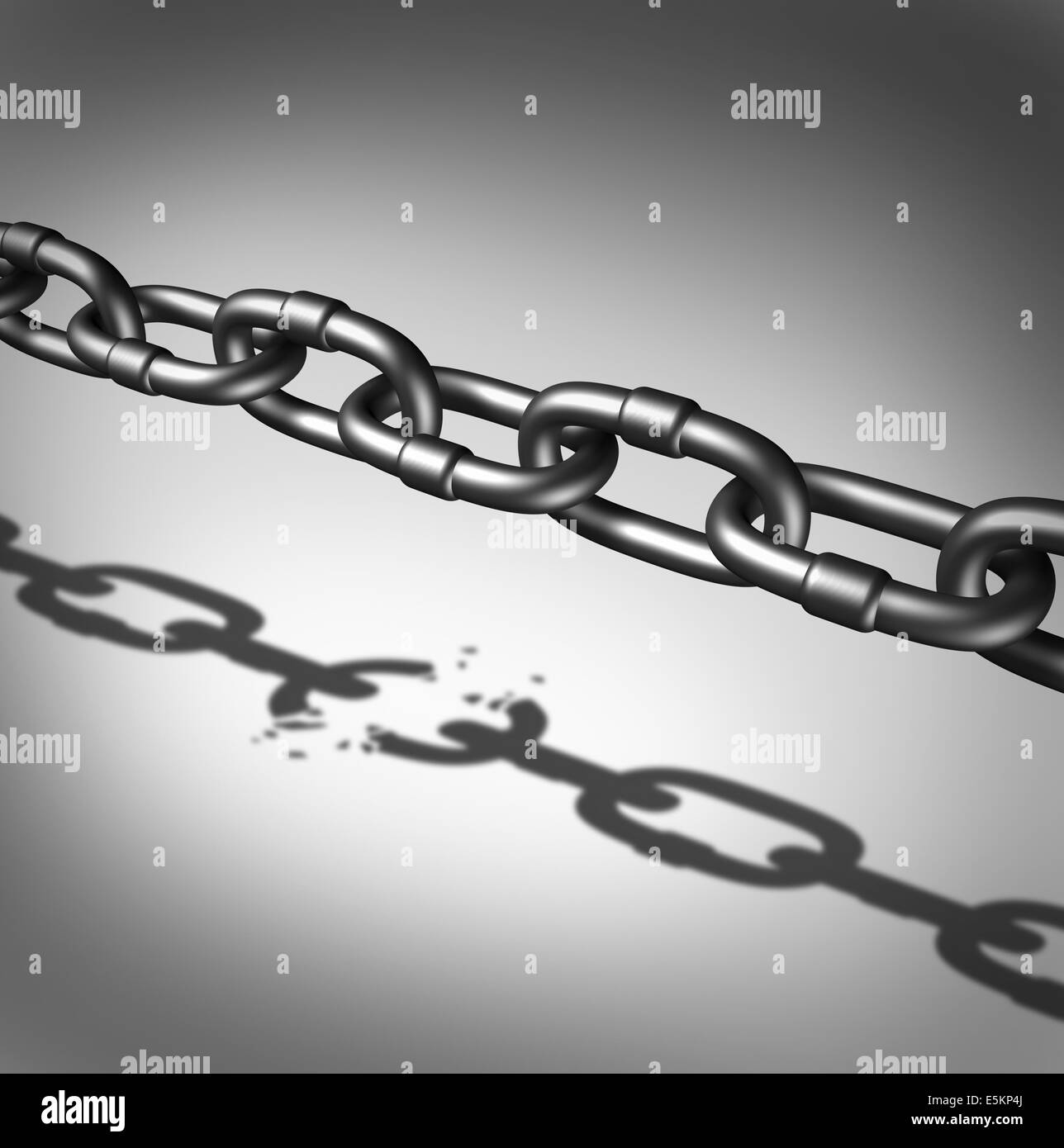 Link breaking and broken chain business concept as iron chains casting a shadow of a broken connection as a metaphor for freedom and the dreams and hopes of breaking out for success. Stock Photo