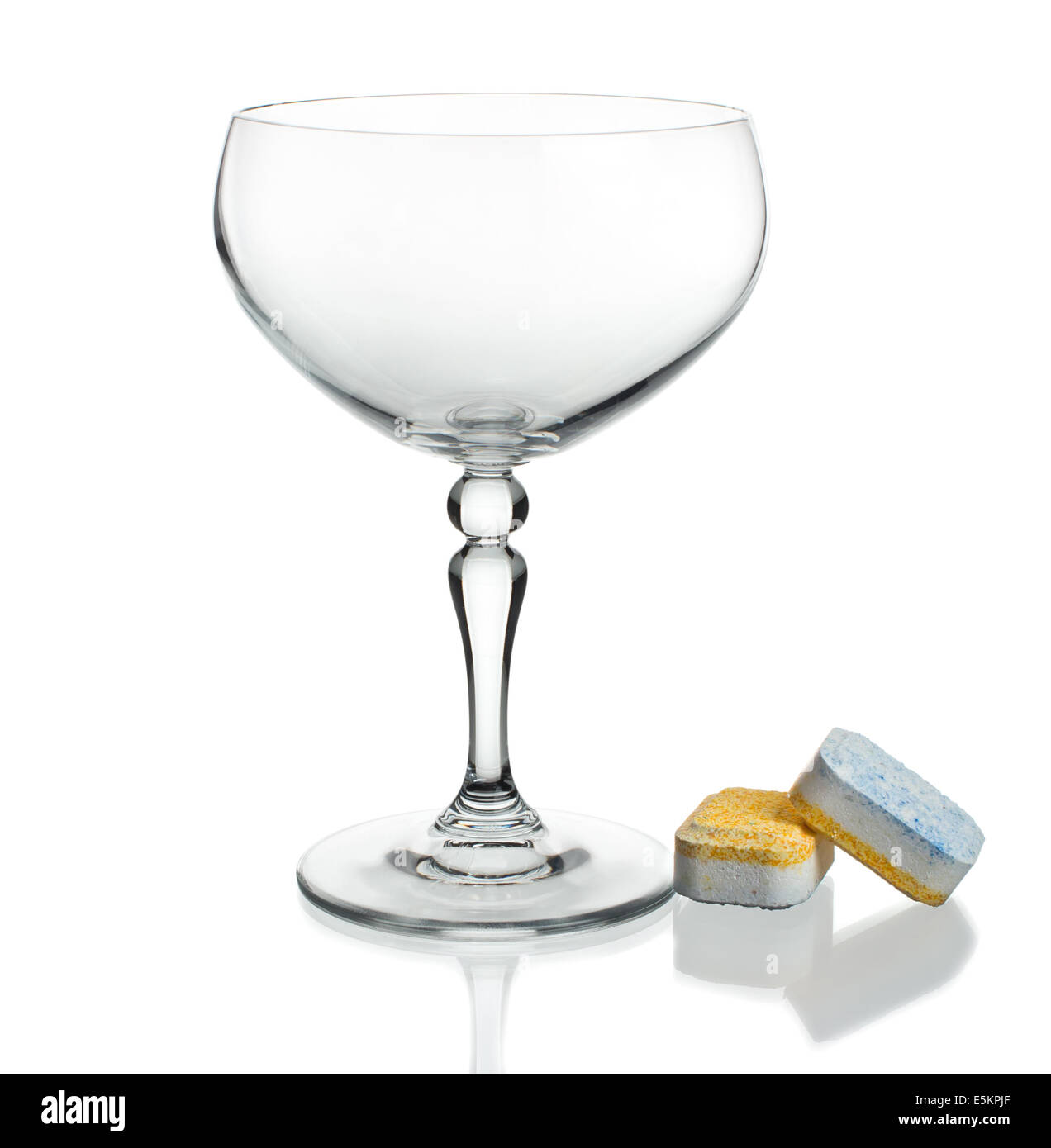 Dishwasher tablets with glass wine glasses on white background isolate