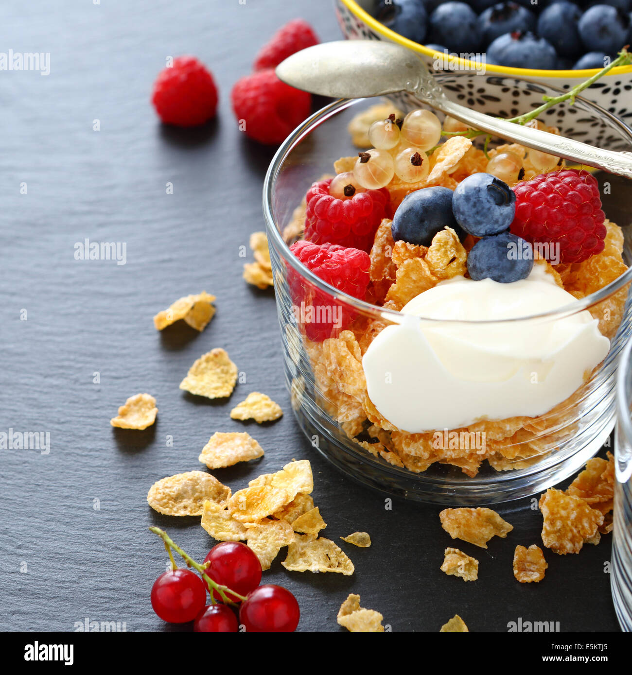 cereal flakes and yogurt in a glass, food closeup Stock Photo