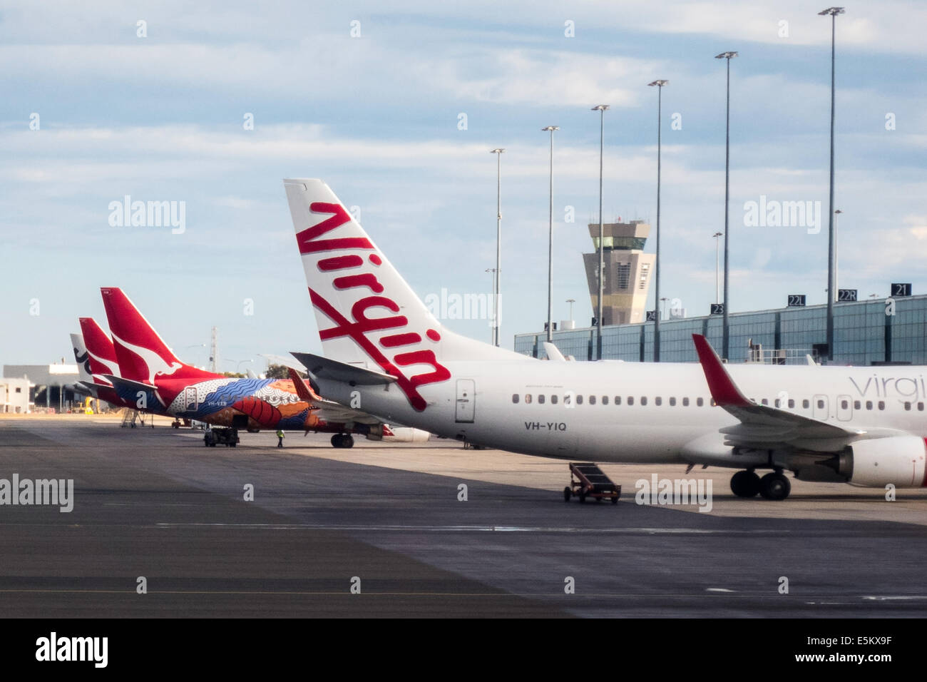 Virgin aircraft on tarmac with Qantas planes at Adelaide airport Australia Stock Photo