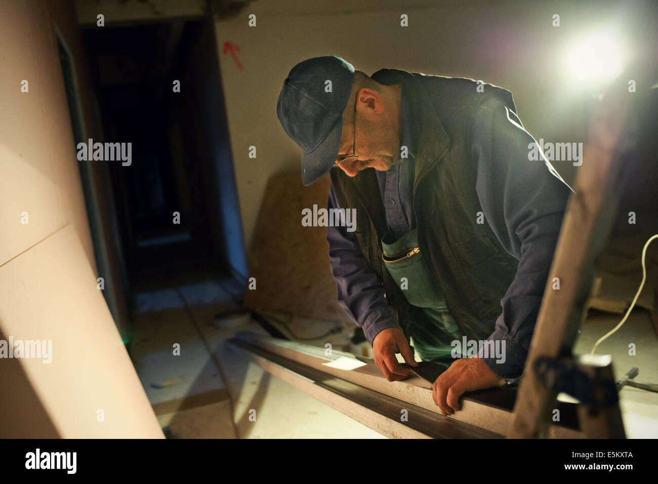Working Without Light Man at work in low light Stock Photo - Alamy
