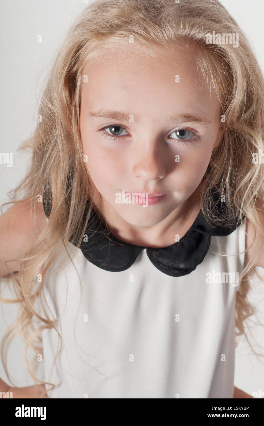 Pretty little girl in white Stock Photo - Alamy