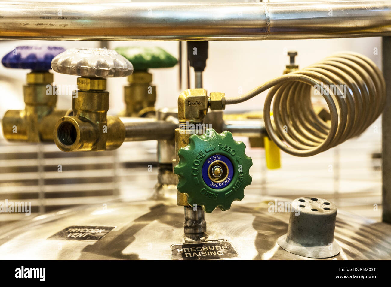 A pressure valve on top of a cylinder of gas in a science research laboratory Stock Photo Alamy