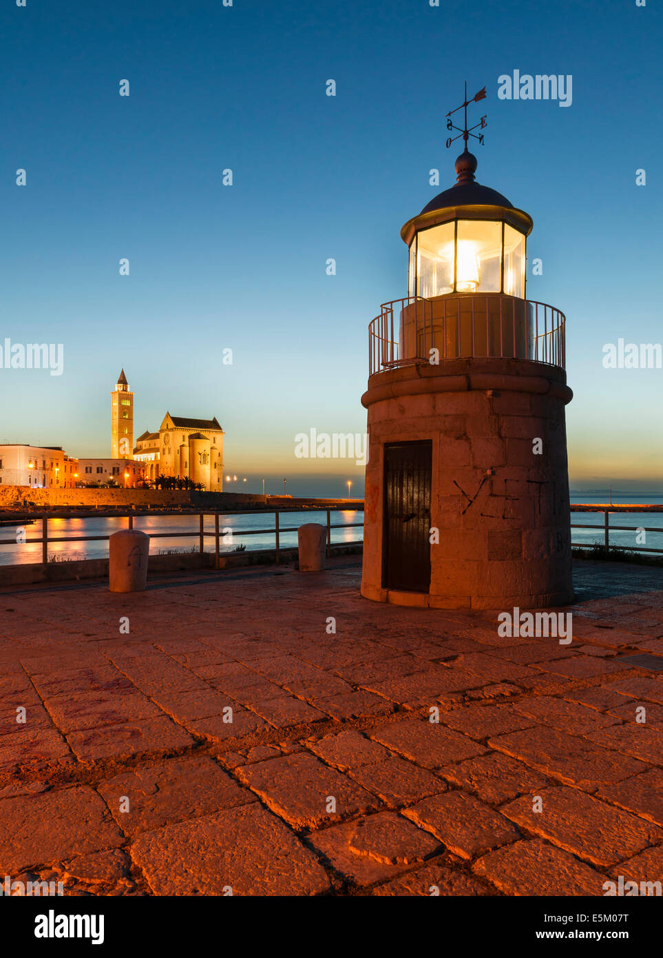 Blue hour, lighthouse, harbour entrance, Gothic Norman Church, Marine Cathedral, Cathedral of San Nicola Pellegrino Stock Photo