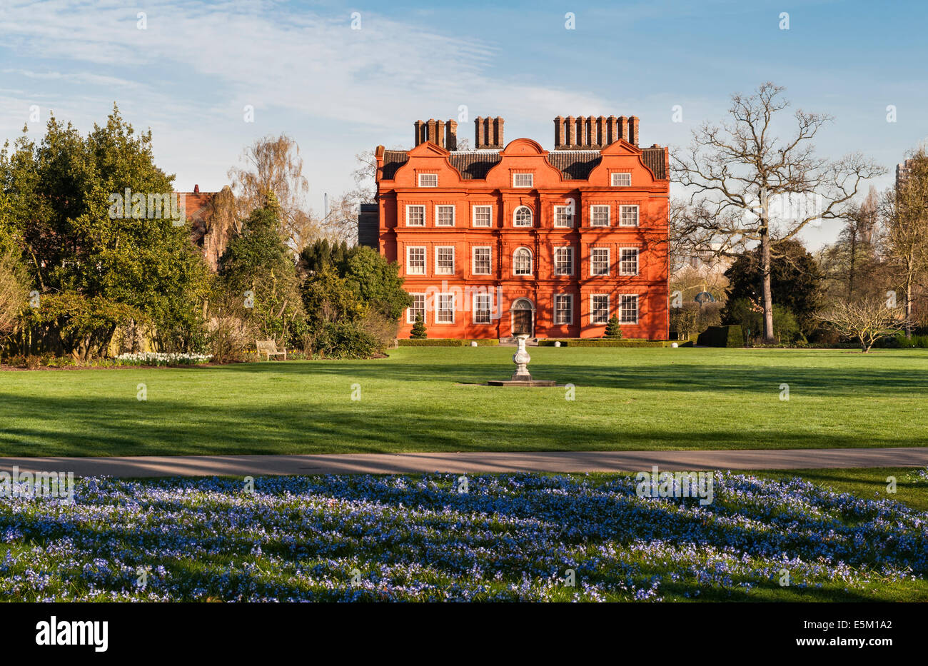 Kew Gardens, London, in the spring. Chionodoxa (glory of the snow) covers the grass in front of Kew Palace (built in 1631) Stock Photo