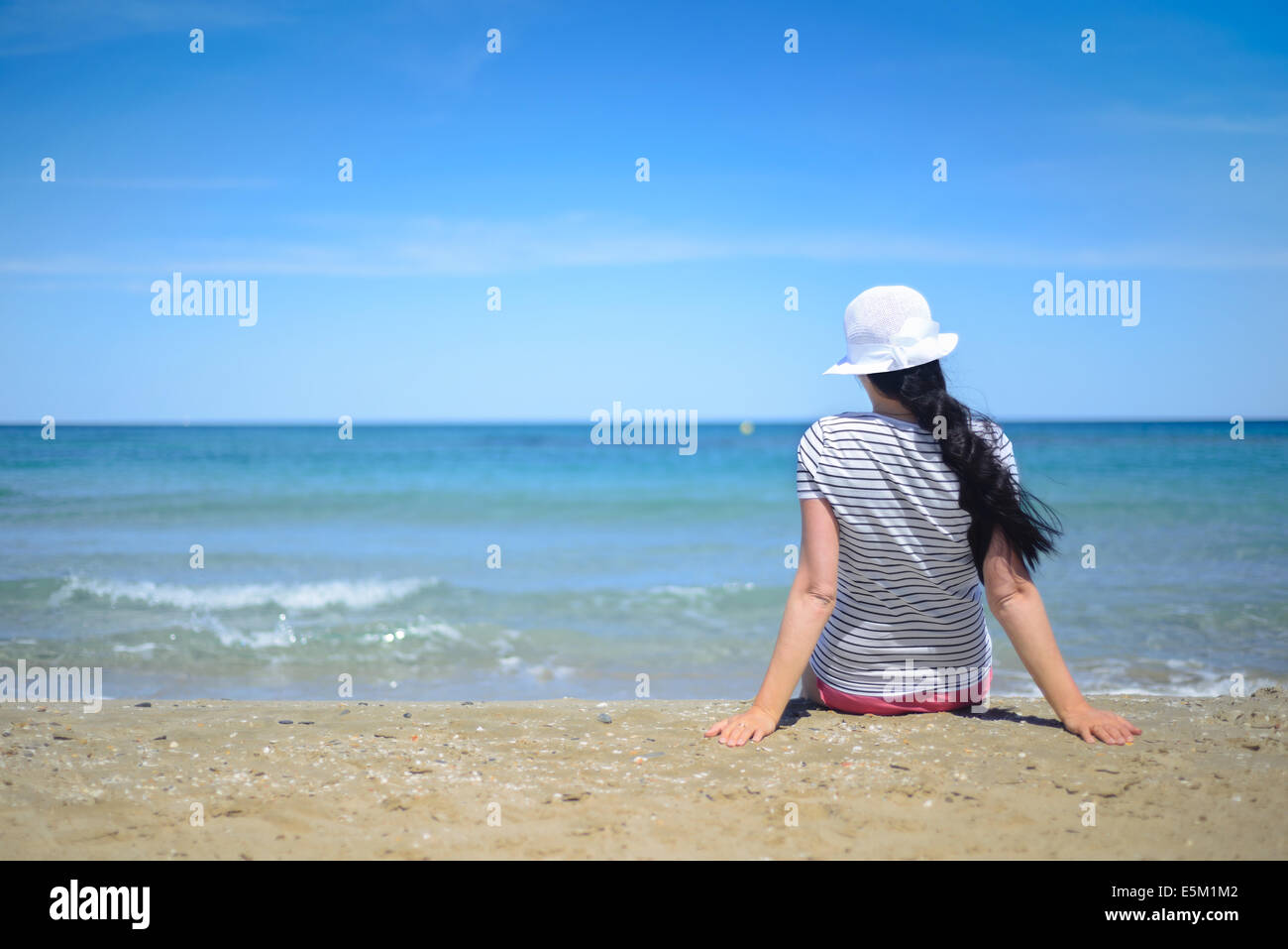 Female Sitting On Beach Alone High Resolution Stock Photography and ...