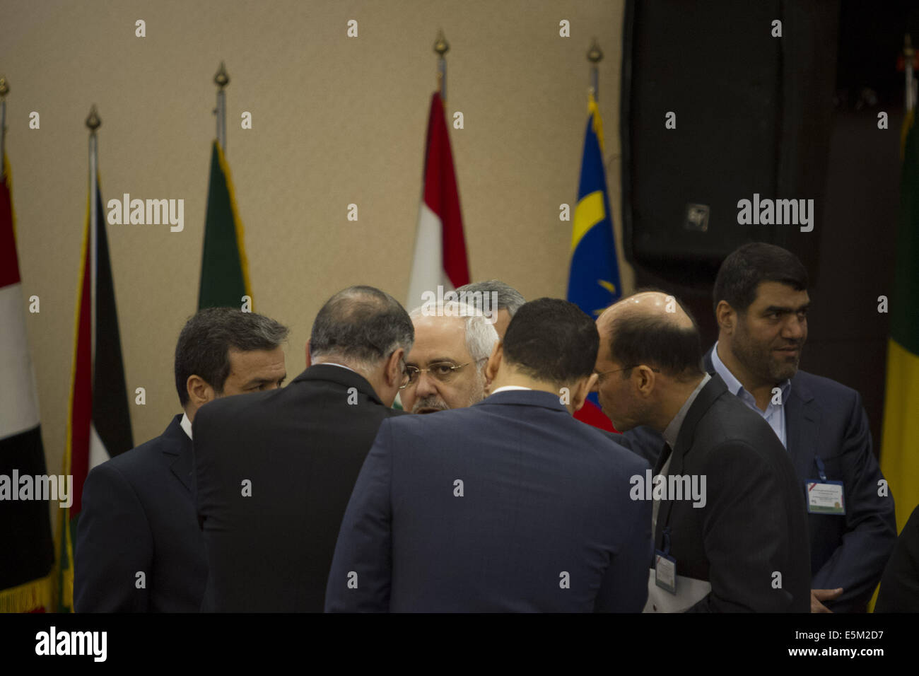 Tehran, Iran. 4th Aug, 2014. August 4, 2014 - Tehran, Iran - Iran's Foreign Minister MOHAMMAD JAVAD ZARIF (C) surrounded by the Iranian officials as he attend the opening of Non-Aligned Movement Ministerial Committee on Palestine Meeting on Situation in Gaza, in Tehran. Morteza Nikoubazl/ZUMAPRESS Credit:  Morteza Nikoubazl/ZUMA Wire/Alamy Live News Stock Photo