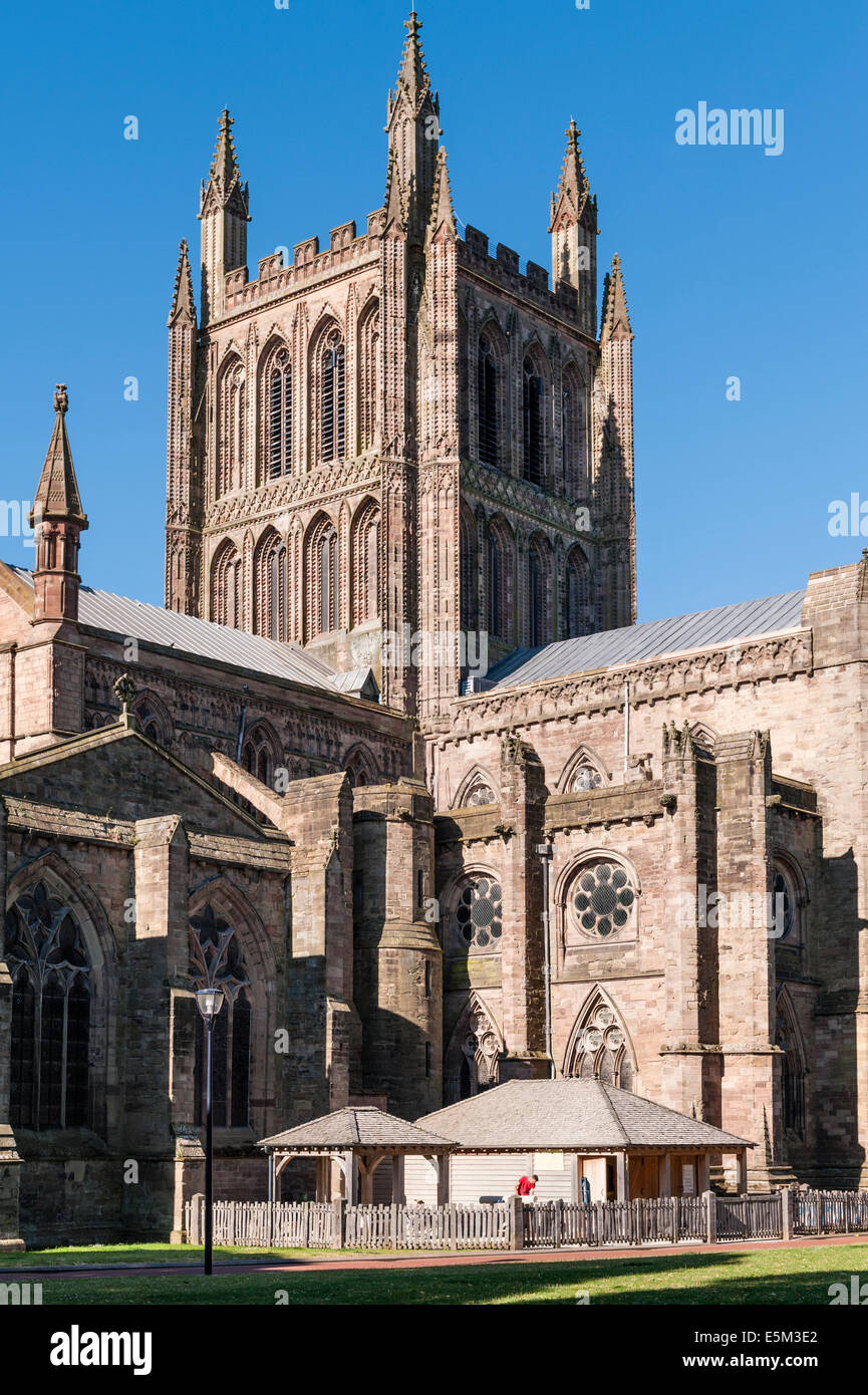 Hereford Cathedral, dating from 1079. A stonemason's yard (bottom of pic) is kept busy working on the fabric of the building (Herefordshire, UK) Stock Photo