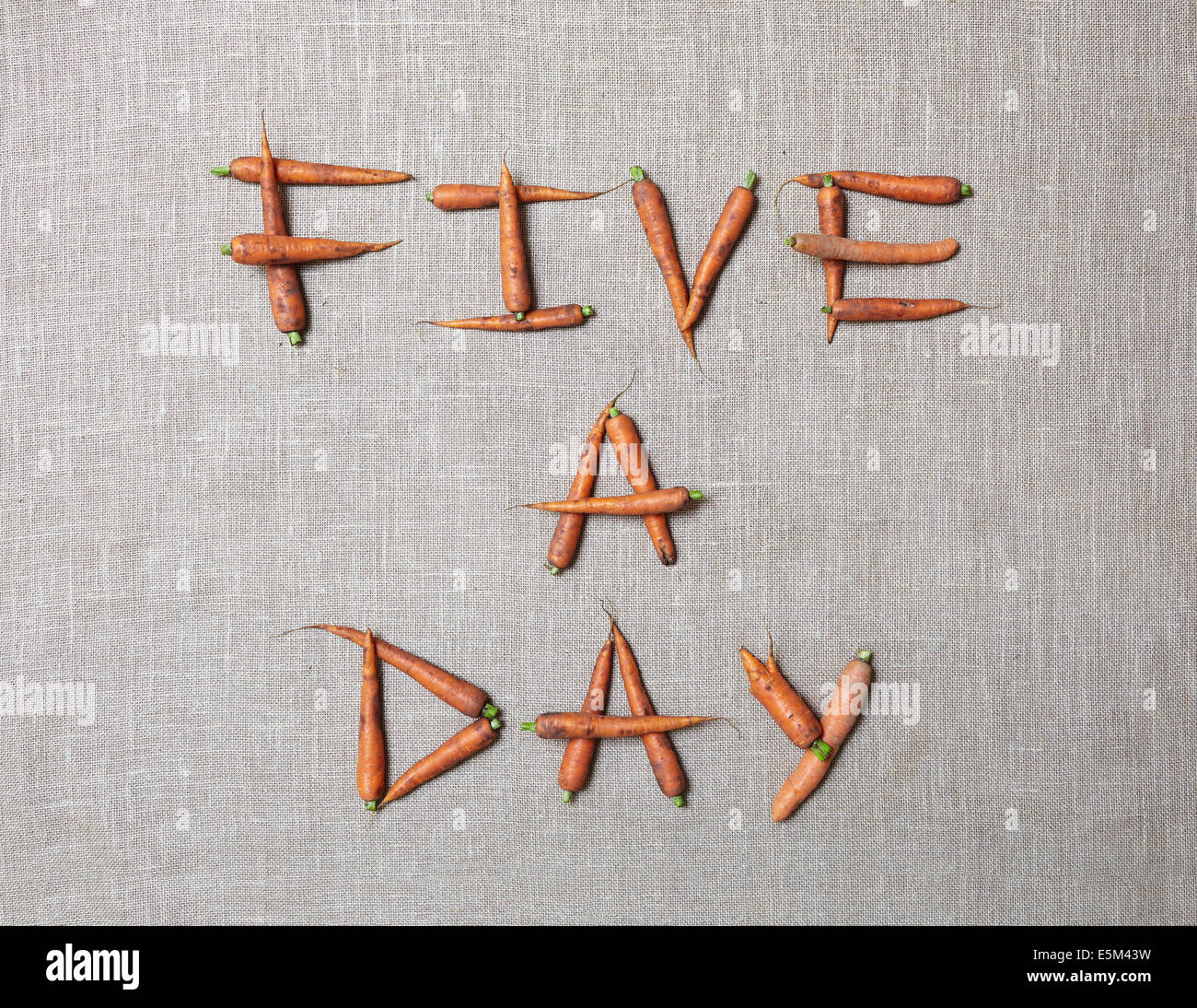 'Five a day' spelt out with organic carrots Stock Photo