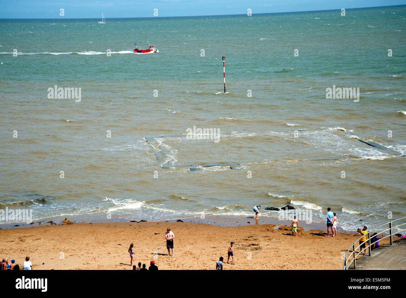 Broadstairs, Kent. Submerged sea swimming pool with people on the beach Stock Photo