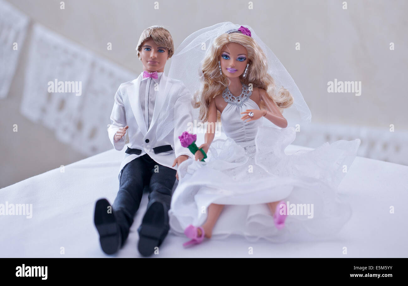 Ken Barbie Bride And Groom Cake Toppers On A Wedding Cake Stock