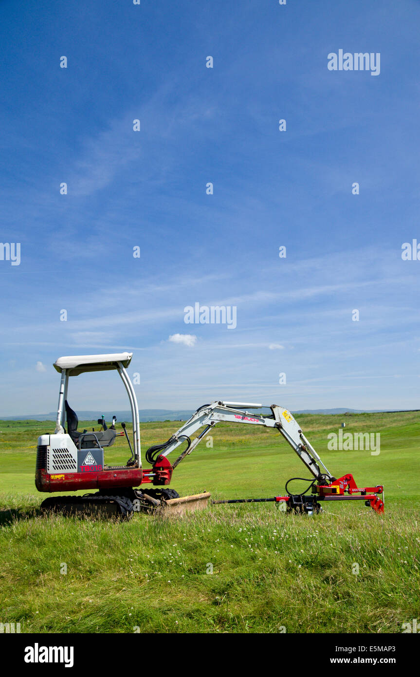 Digging machine, Royal Porthcawl Golf Club, South Wales, UK. Stock Photo
