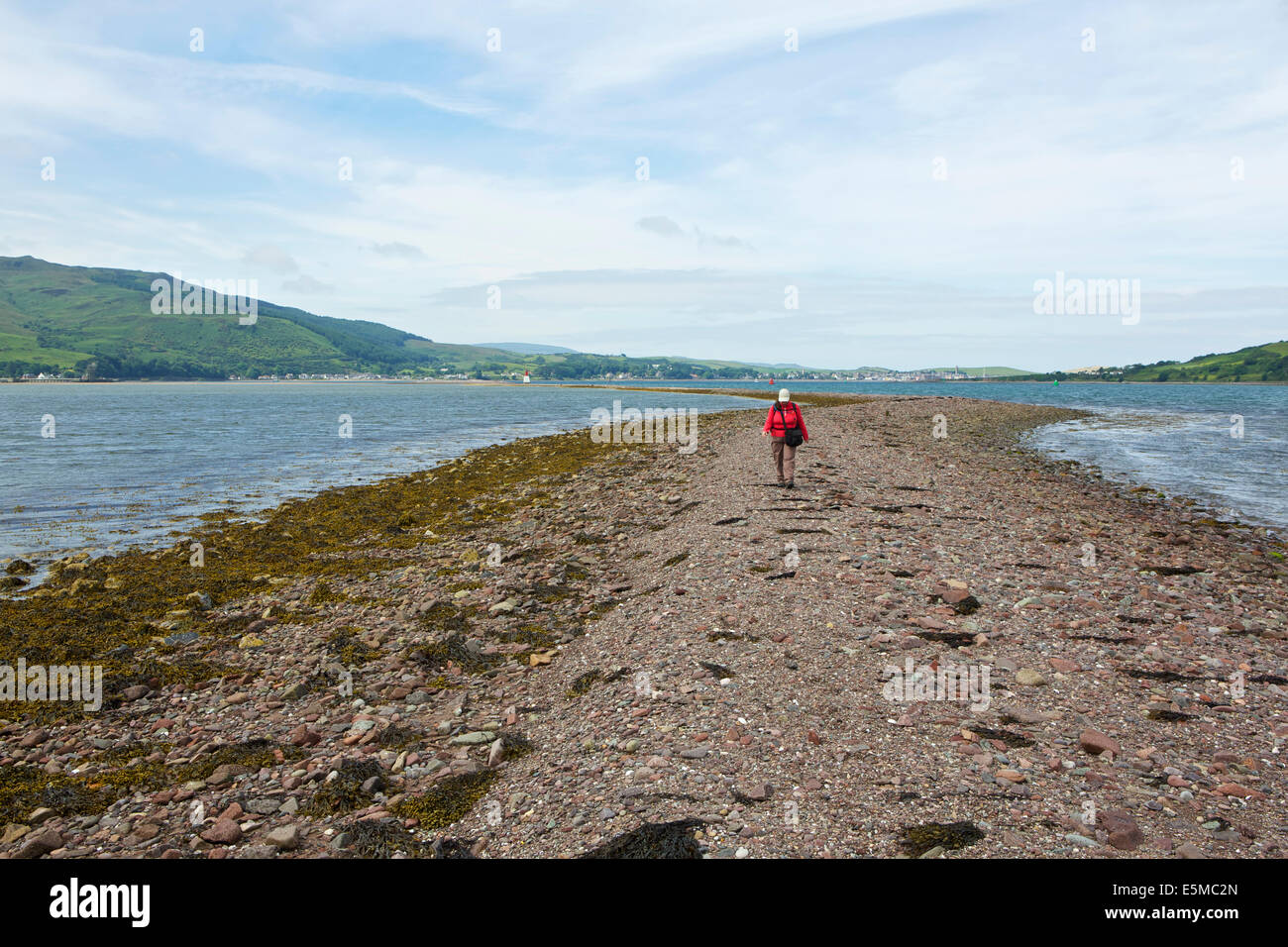 Causeway to Davaar Island seen at low tide with Campbeltown beyond Stock Photo