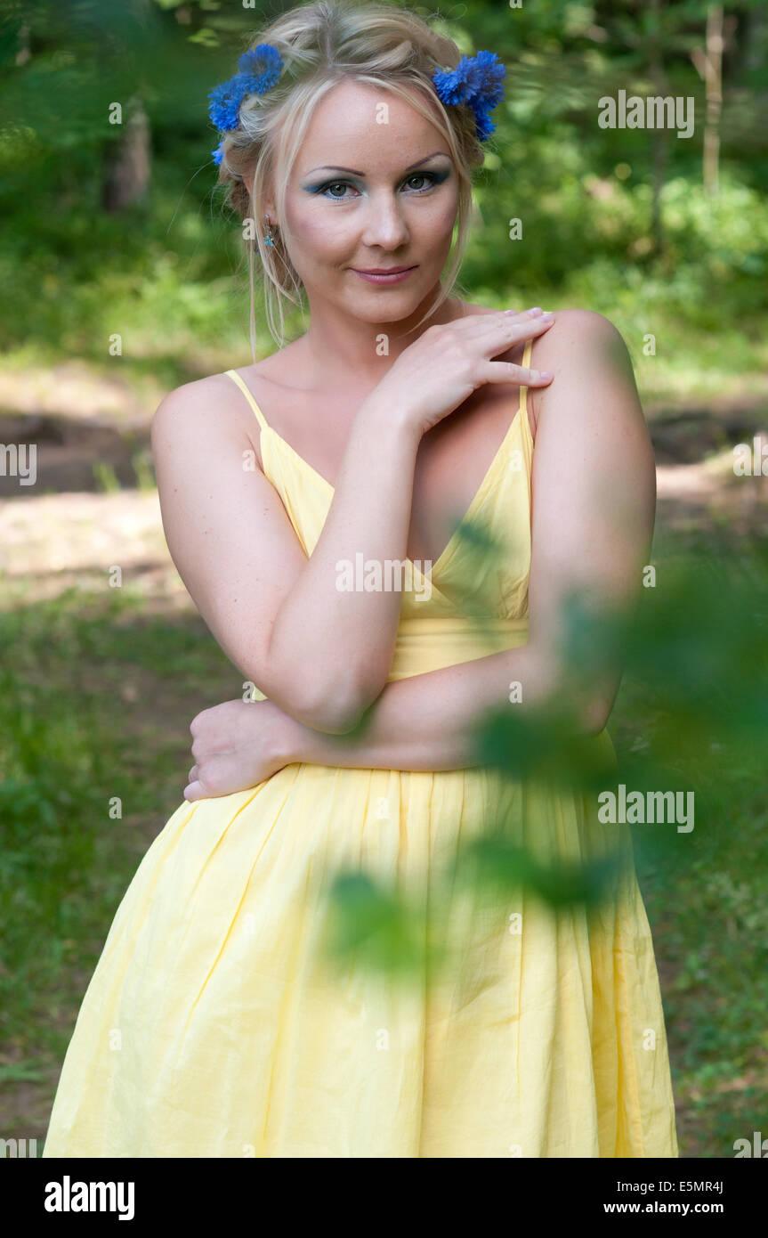 Pretty young girl in the forest Stock Photo - Alamy