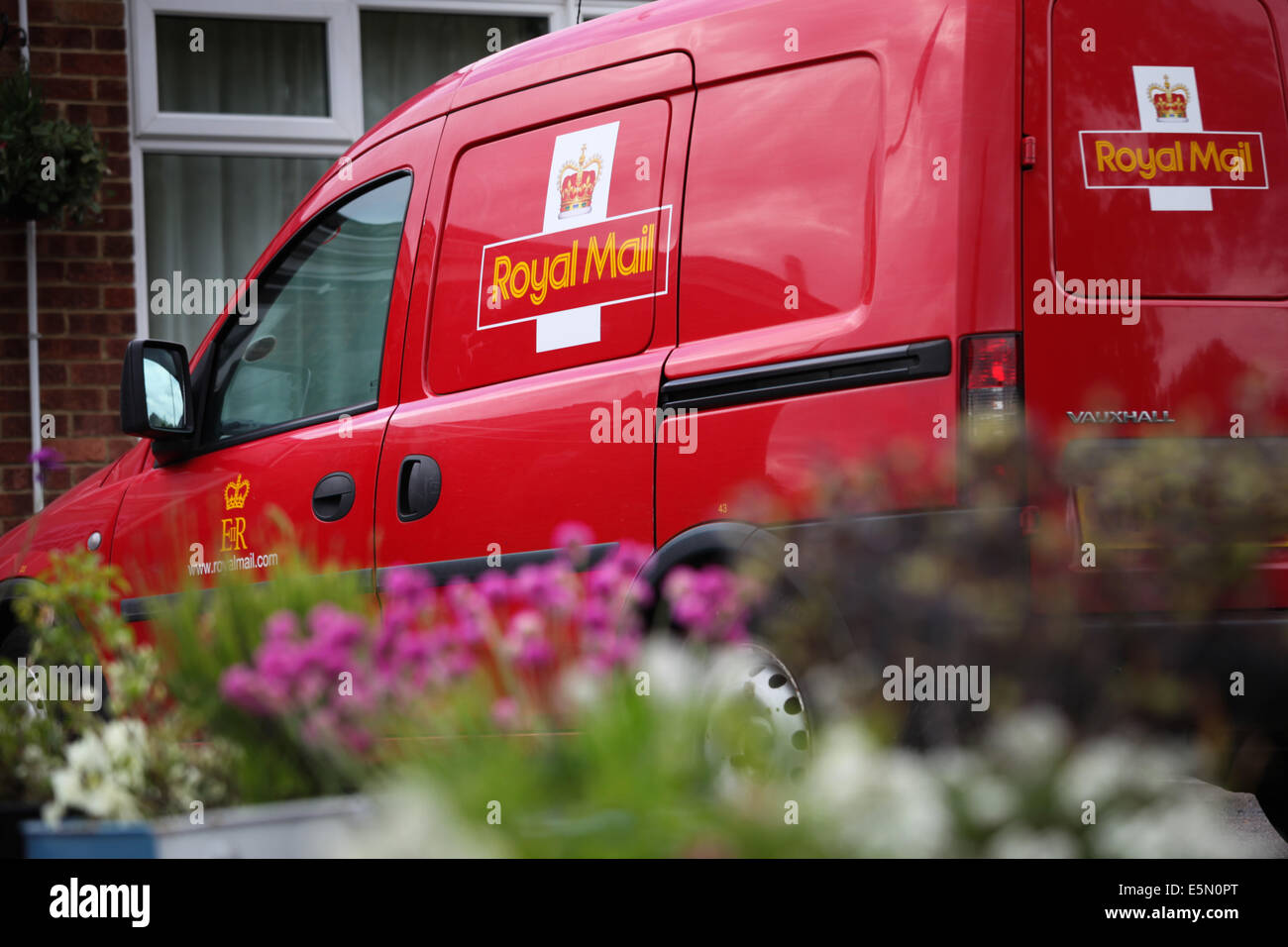 A Royal Mail delivery van parked outside the Royal British Legion in Old Basing, Hampshire, UK Stock Photo