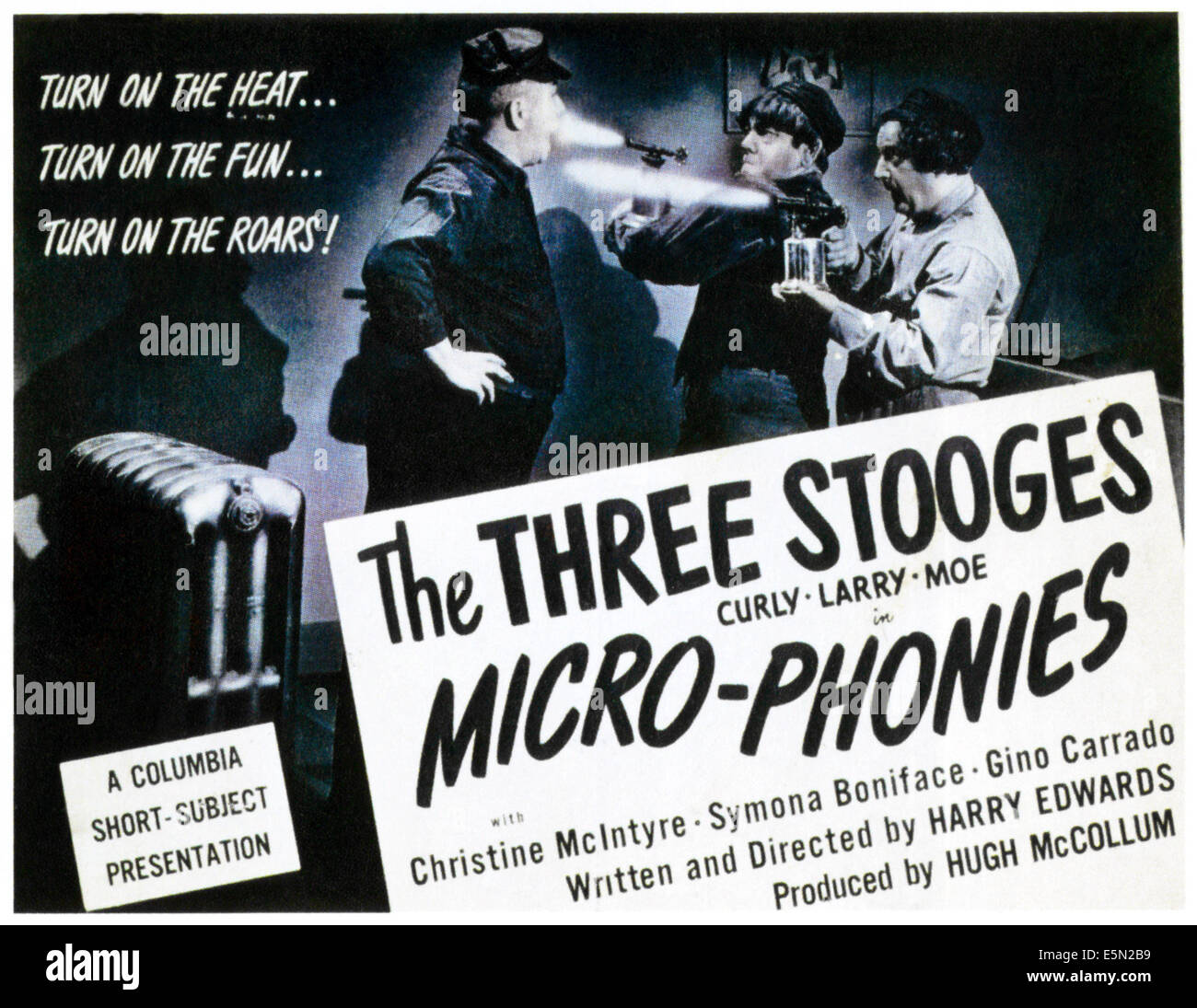 MICRO-PHONIES, The Three Stooges from left: Curly Howard, Moe Howard, Larry Fine on title card, 1945. Stock Photo