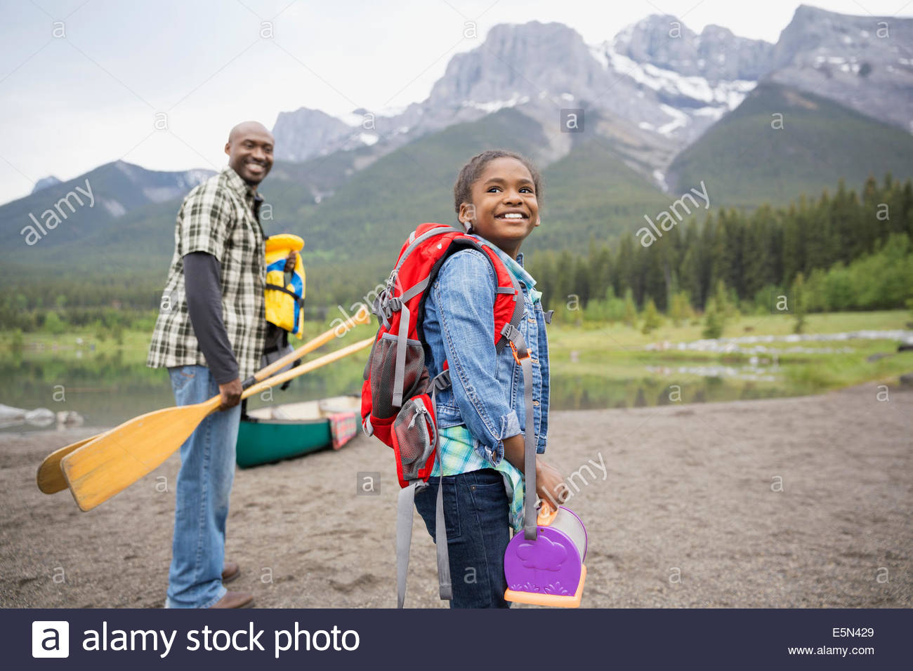 Father and daughter preparing to canoe Stock Photo