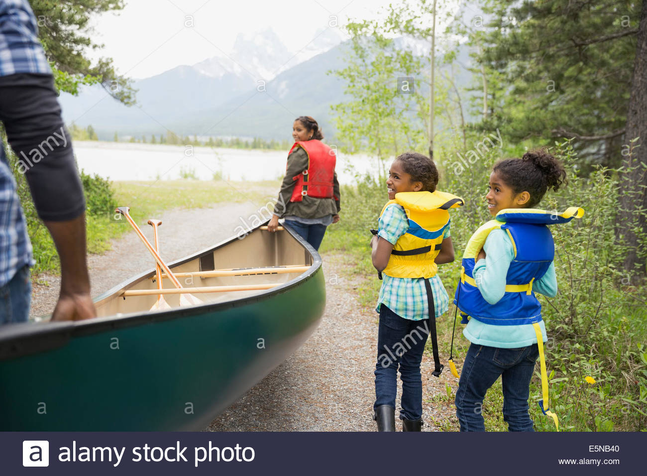 Carrying Canoe Together Stock Photos & Carrying Canoe Together Stock