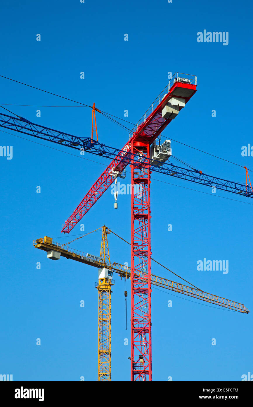 Construction cranes / tower crane against blue skyky Stock Photo