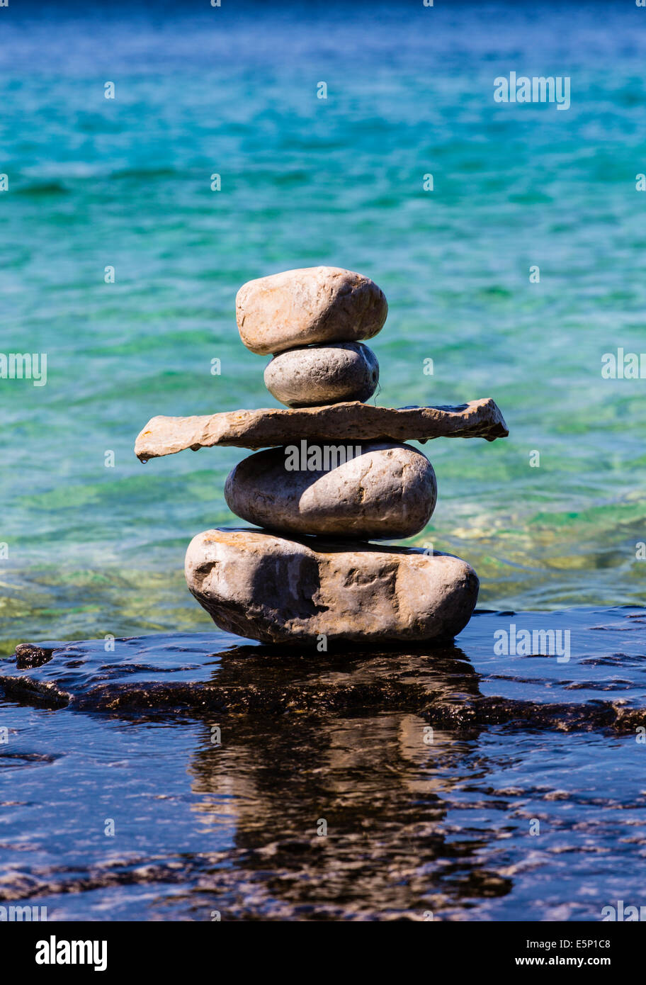 Bruce Peninsula National Park Georgian Bay Tobermory Ontario Canada. Inukshuk on shore of Georgian bay Ontario Canada. Stone lan Stock Photo