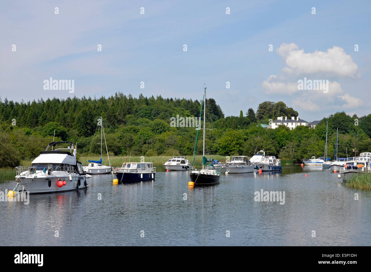 Pleasure boats moored on Lough Corrib in a quiet bay at Lisloughery Pier,Cong on the Mayo/Galway