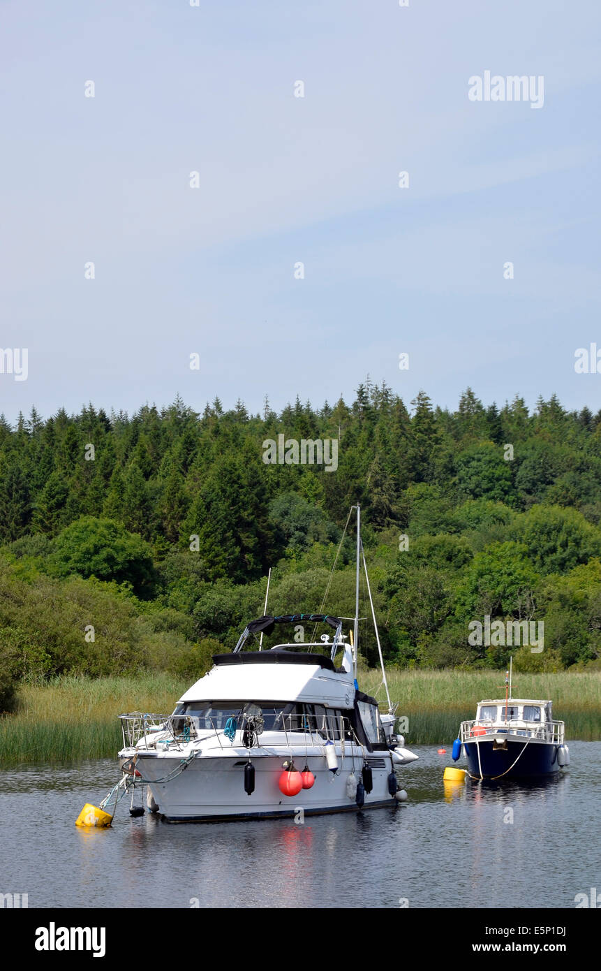Pleasure boats moored on Lough Corrib in a quiet bay at Lisloughery Pier,Cong on the Mayo/Galway