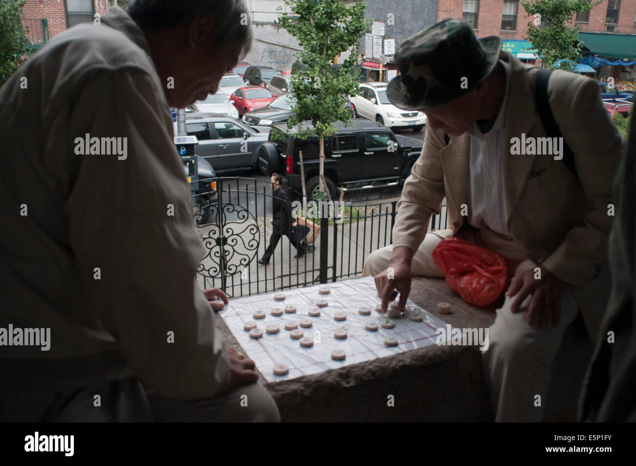 Chinese men playing mahjong aka mah jongg Columbus Park Chinatown New York City lower east side. Columbus Park (Mulberry St betw Stock Photo
