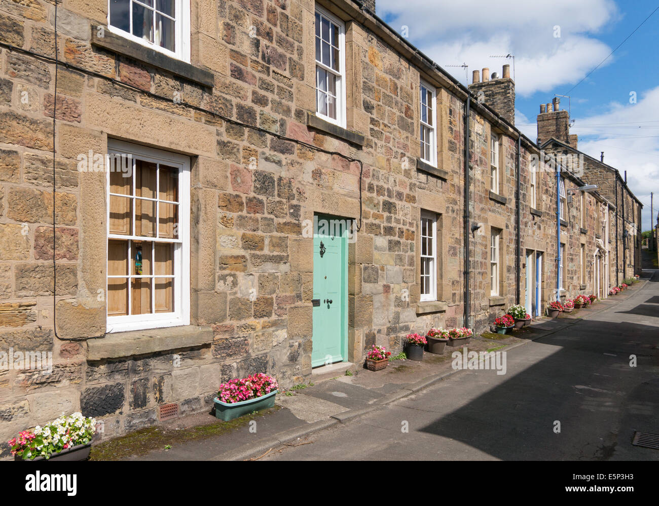 Street of stone built terraced houses Alnmouth, Northumberland, north east England, UK Stock Photo