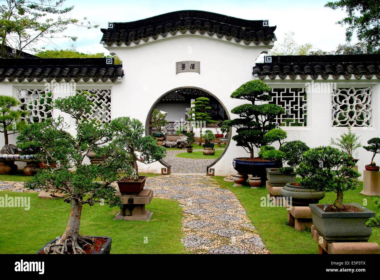 SINGAPORE A moongate pierces a wall at the Bonsai Gardens in the