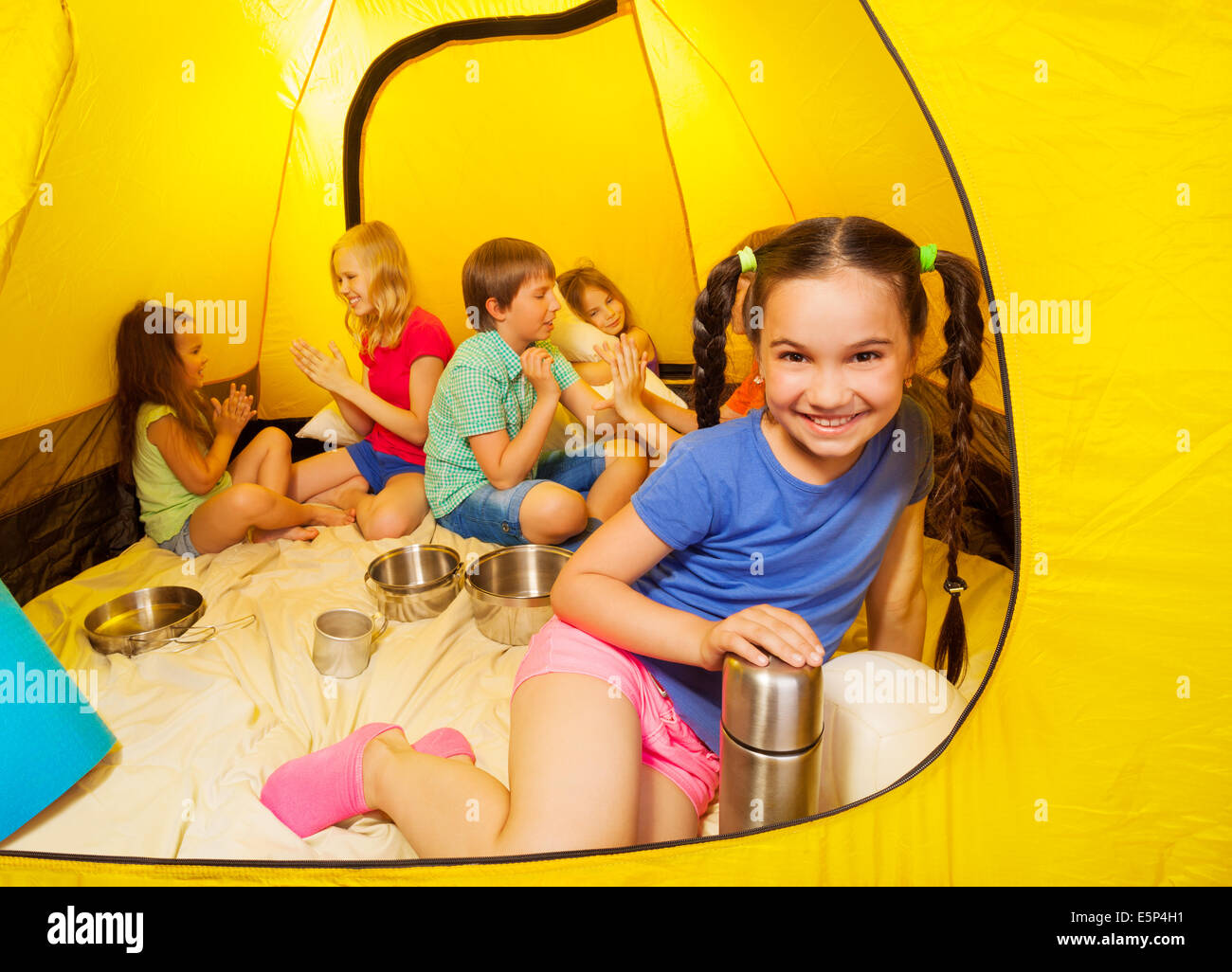 Six children play in a tent Stock Photo