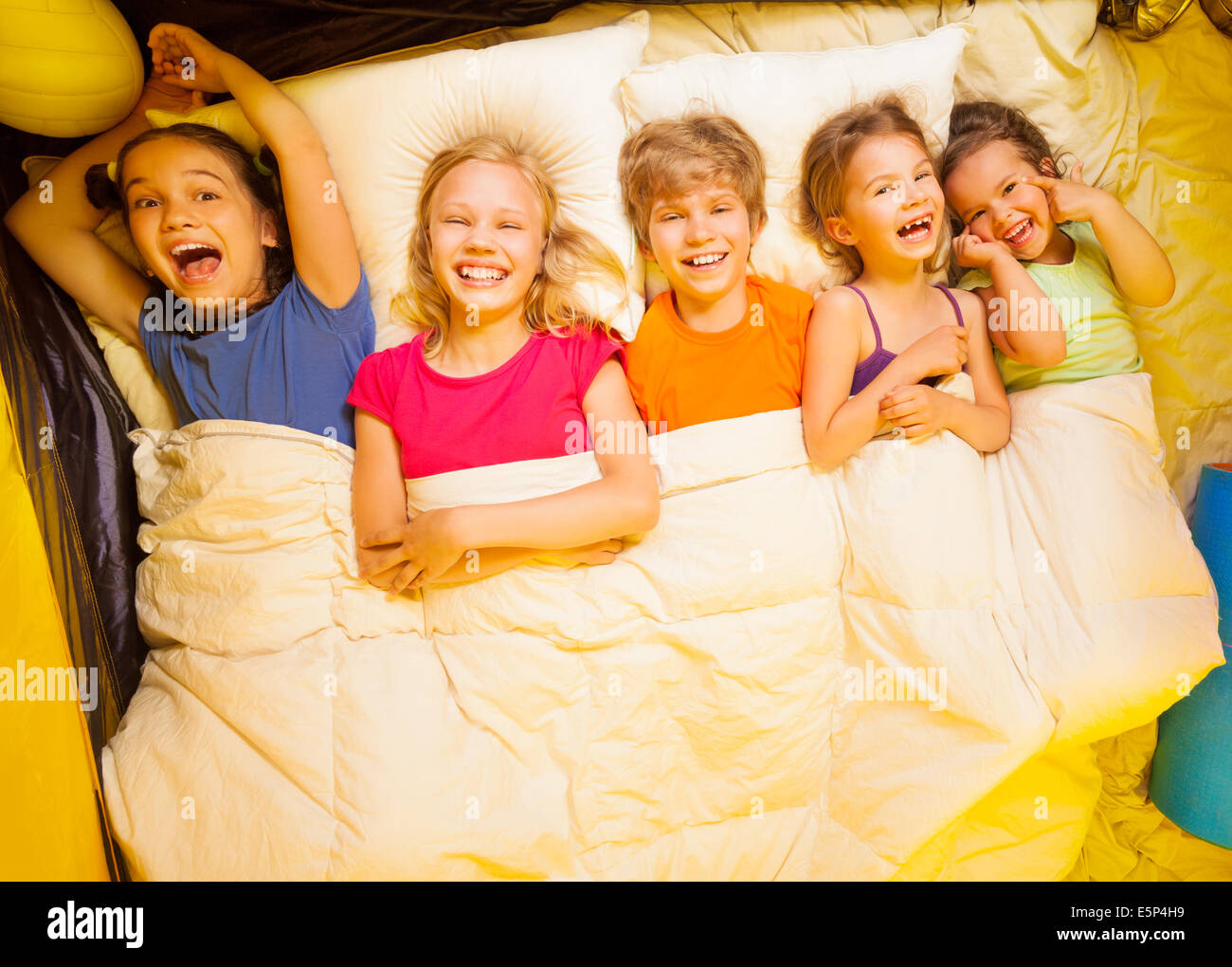 Young girls under blanket smile hires stock photography and images Alamy