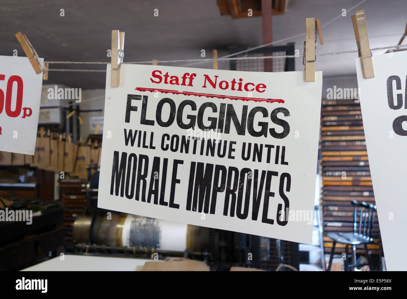 Staff workplace morale boosting sign signs Blists Hill Victorian Town Stock Photo