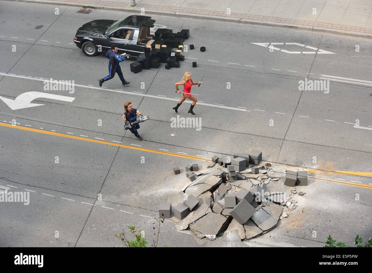 Toronto, Ontario, Canada. 4th Aug, 2014. On the movie set at 909 Bay Street in Toronto. 'Pixels' is an upcoming 2015 American 3D live-action/computer-animated film produced by Columbia Pictures and Happy Madison Productions. The film is directed by CHRIS COLUMBUS from a screenplay written by Tim Herlihy and Timothy Dowling. Main actors: ADAM SANDLER, KEVIN JAMES, JOSH GAD, PETER DINKLAGE, MICHELLE MONAGHAN, BRIAN COX, ASHLEY BENSON, and JANE KRAKOWSKI. Credit:  ZUMA Press, Inc./Alamy Live News Stock Photo