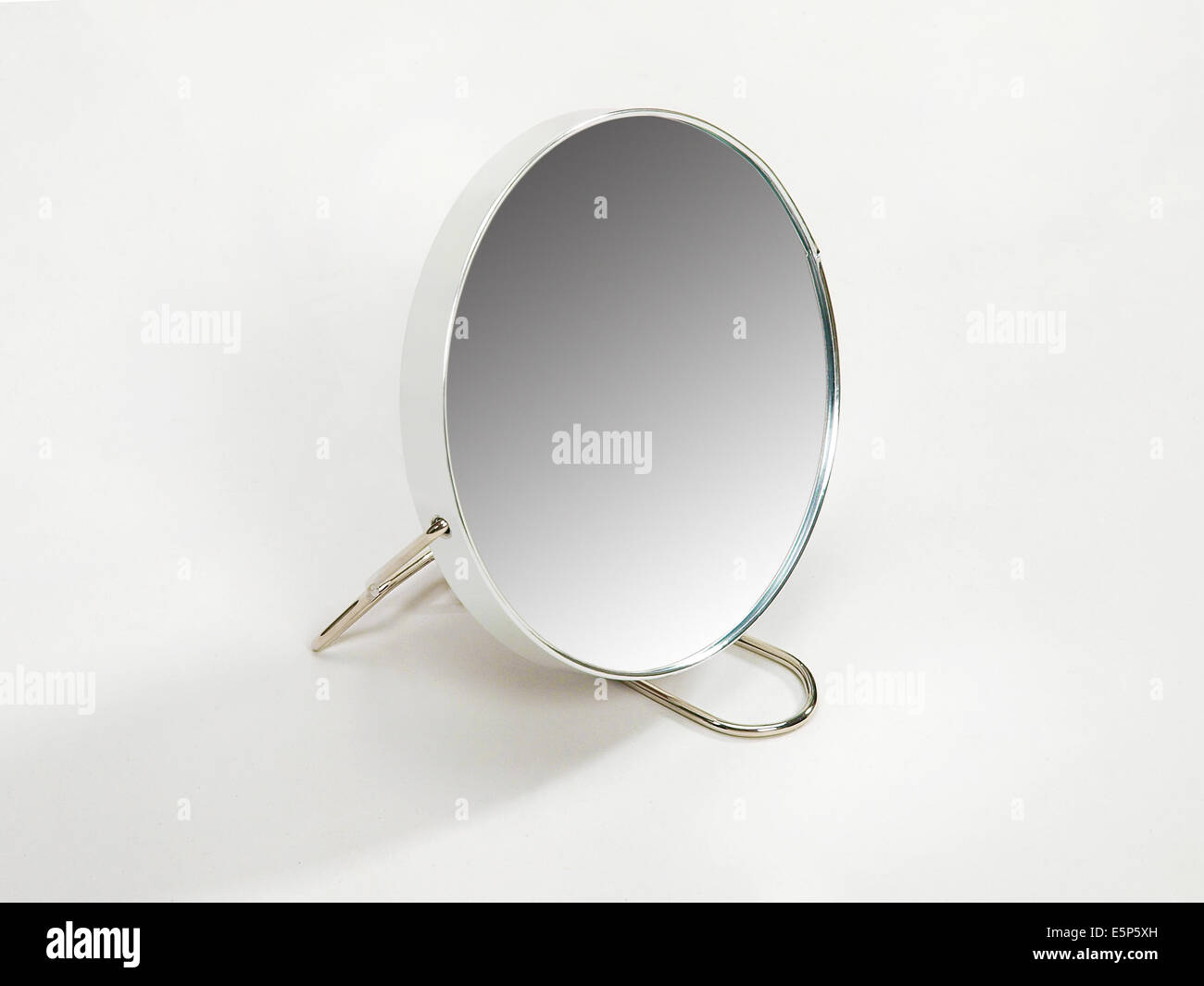 Round mirror on stand Stock Photo Alamy