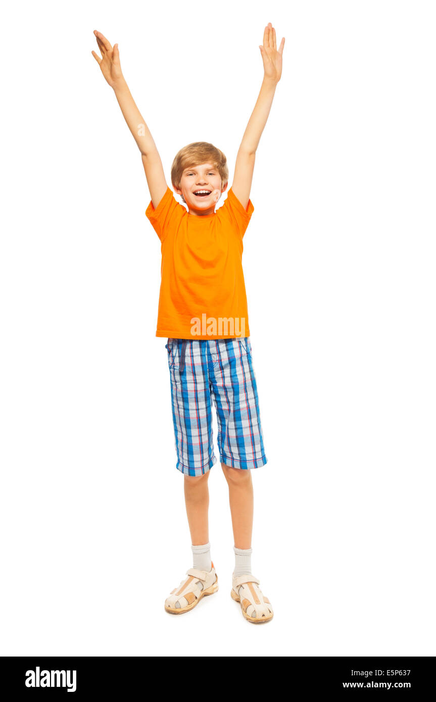 Young boy raises hands up Stock Photo