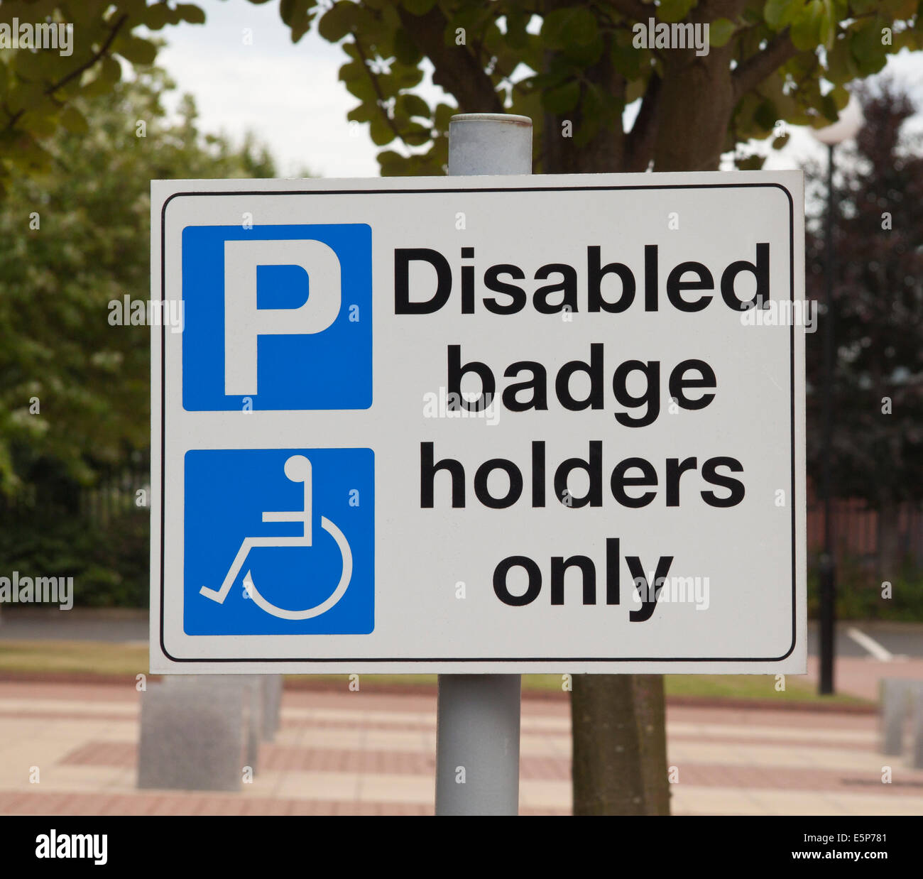 Disabled parking badge holders only sign in a UK car park. Stock Photo