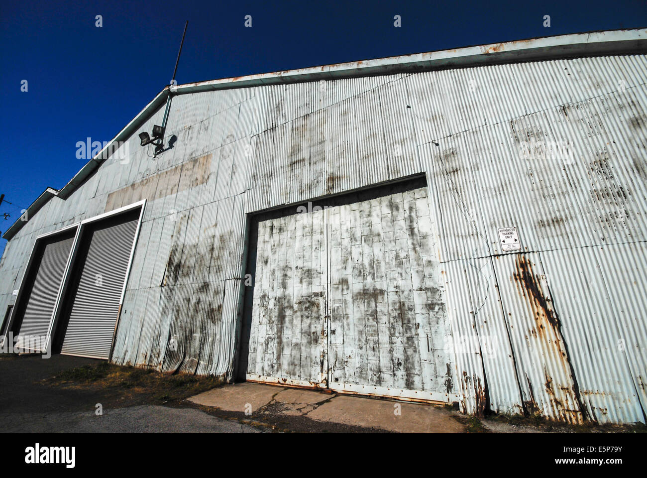 A corrugated metal warehouse on the docks of Hamilton harbour in Hamilton Ontario Canada Stock Photo