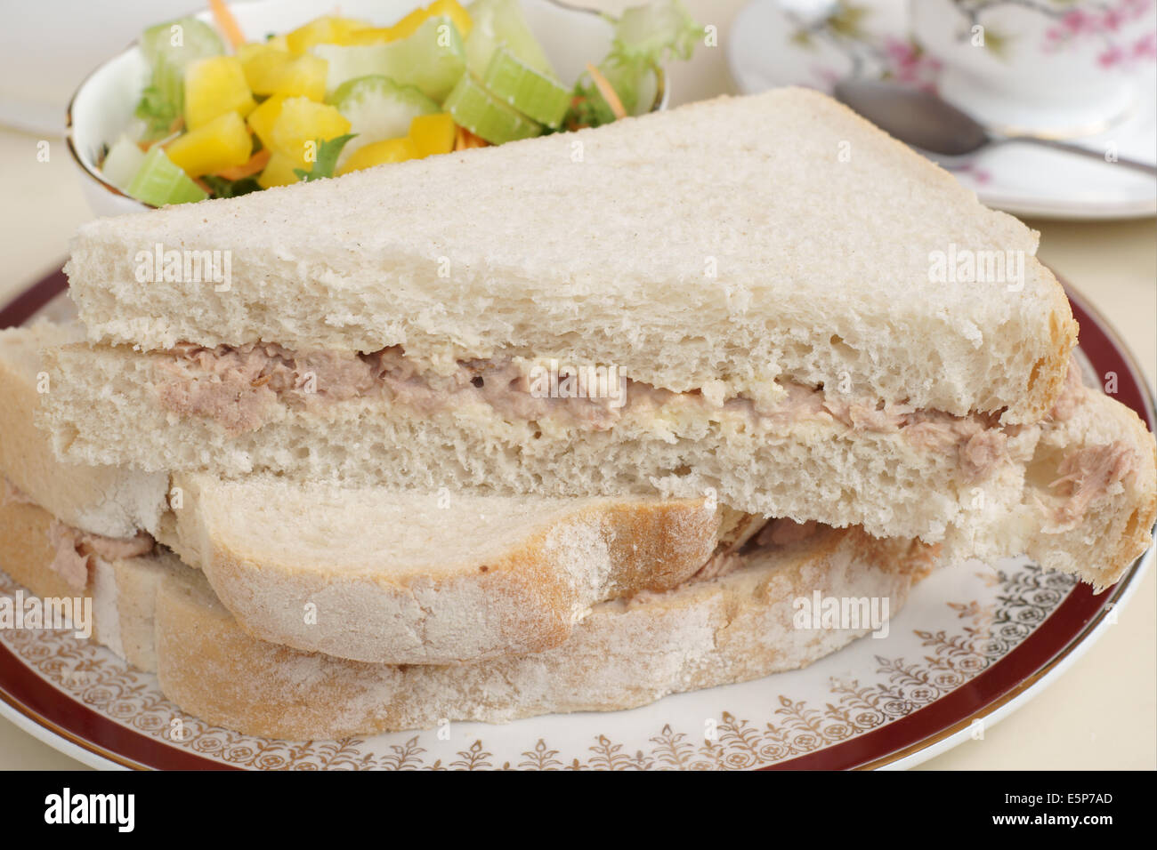 Hand cut tuna mayonnaise sandwich with a celery and capsicum side salad