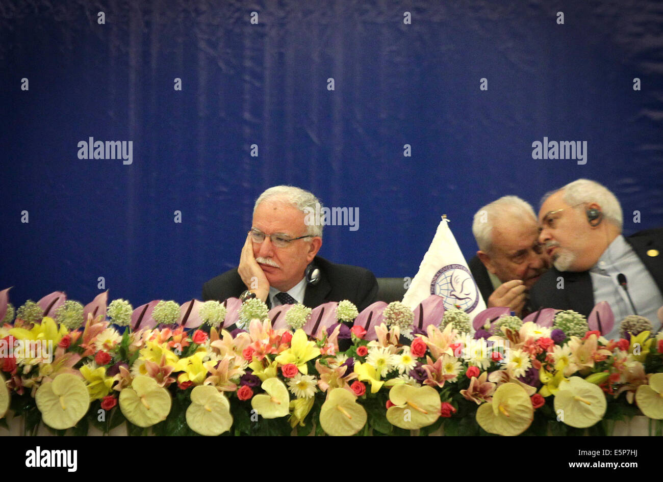 Tehran, Iran. 4th Aug, 2014. Palestinian Foreign Minister Riyad al-Maliki (L) attends an emergency meeting of Palestine Committee of the Non-Aligned Movement (NAM) in Tehran, Iran, on Aug. 4, 2014. The NAM's one-day emergency meeting opened here on Monday. Credit:  Ahmad Halabisaz/Xinhua/Alamy Live News Stock Photo