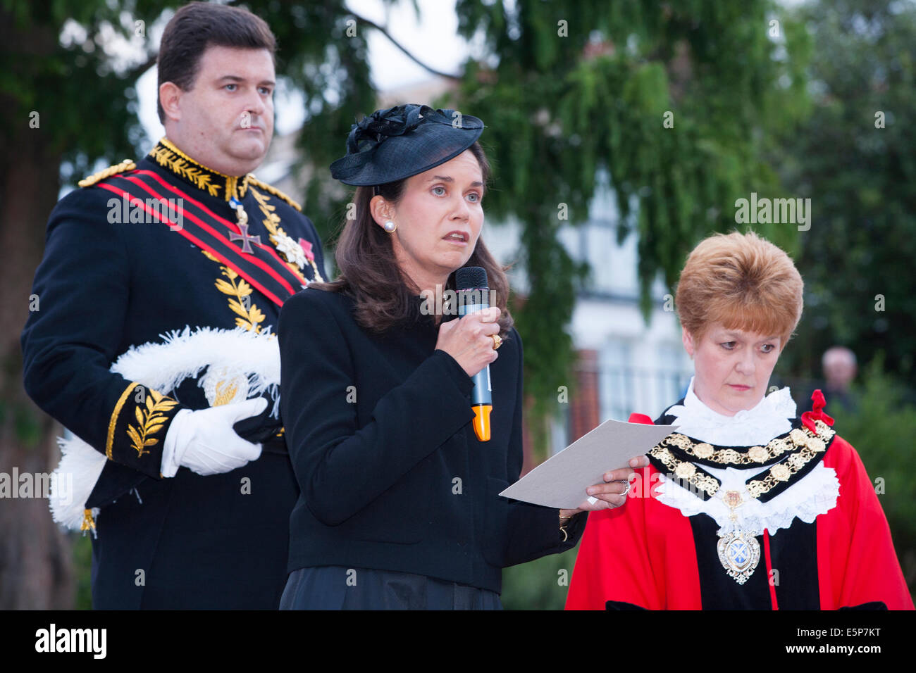 Twickenham, London, UK. 4th Aug, 2014. Centre - speaking into the microphone - Her Serene Highness Princess Marie-Therese von Hohenberg (great-granddaughter of Archduke Franz Ferdinand of Austria–Hungary - whose assassination in June 1914 lead directly to World War 1 - The Great War of 1914/1918) at a service to mark the 100th anniversary of Great Britain's entry into the The First World War. The service was held at Radnor Gardens; Twickenham; London UK on Monday August 4; 2014. Left is her husband; Mr. Credit:  David Gee/Alamy Live News Stock Photo
