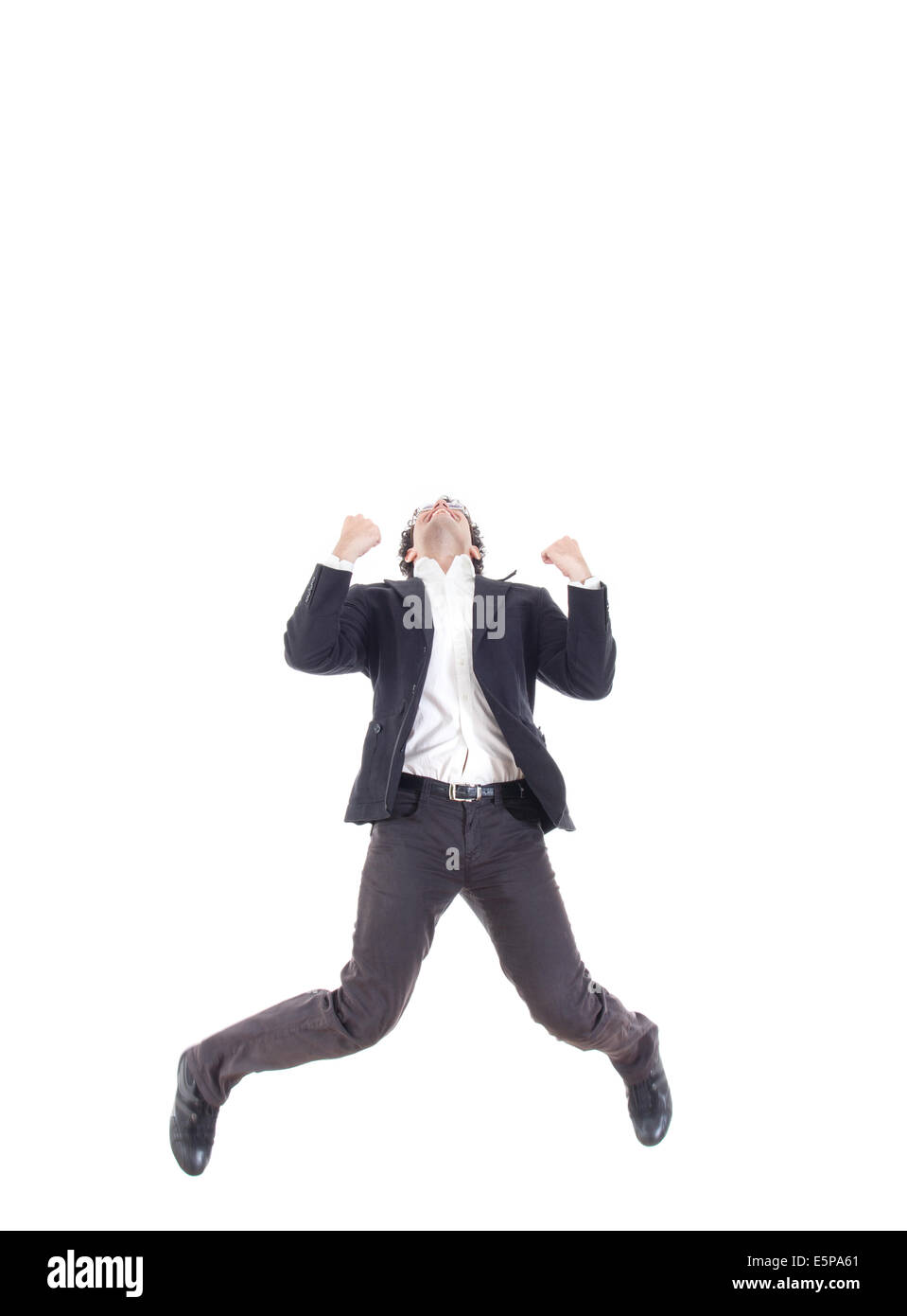 Business man jumping of joy and success with legs spread, isolated over a white background Stock Photo