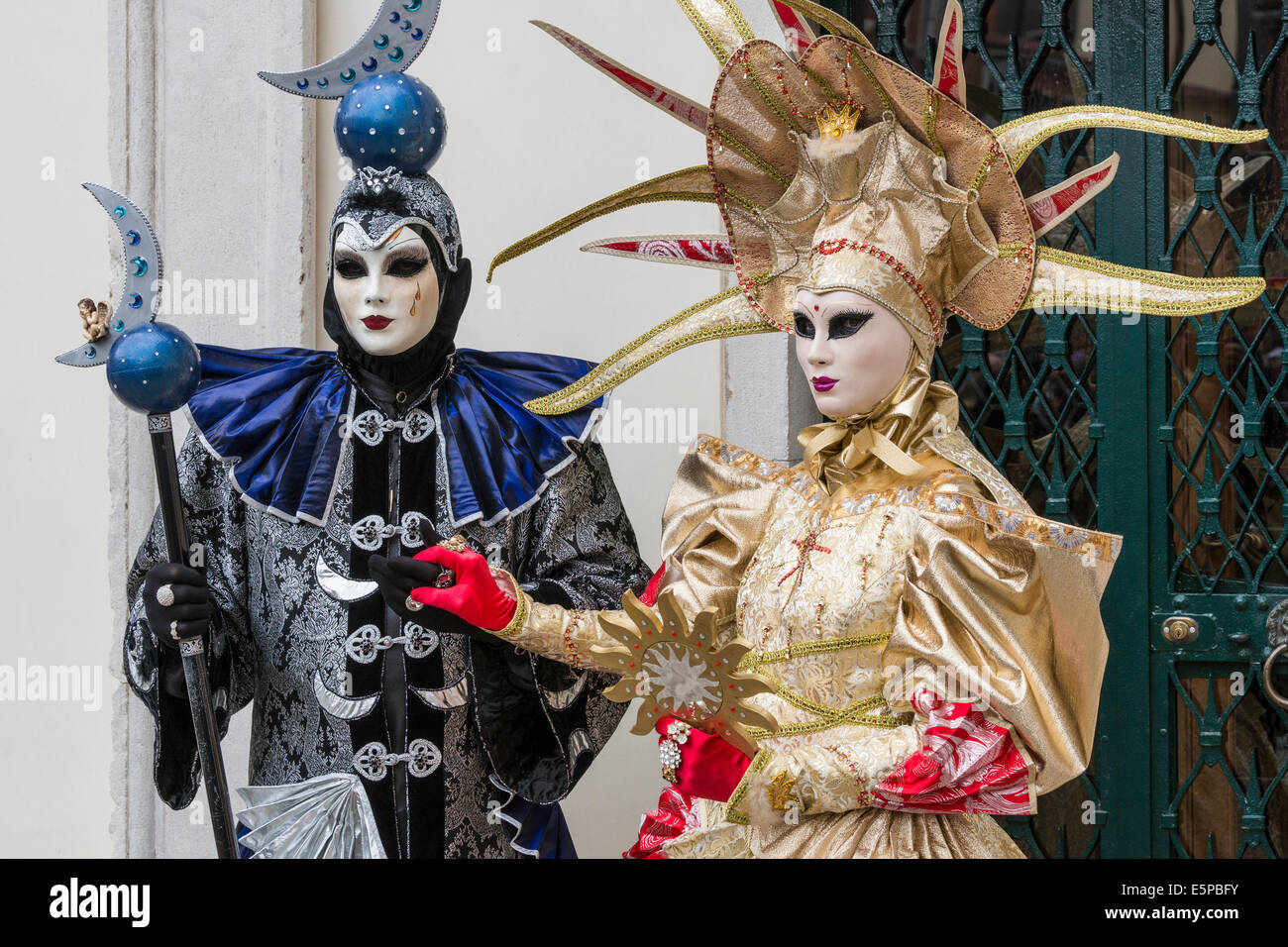 Couple in elaborate moon and sun costumes in San Zaccaria Square during  Carnival in Venice Stock Photo - Alamy