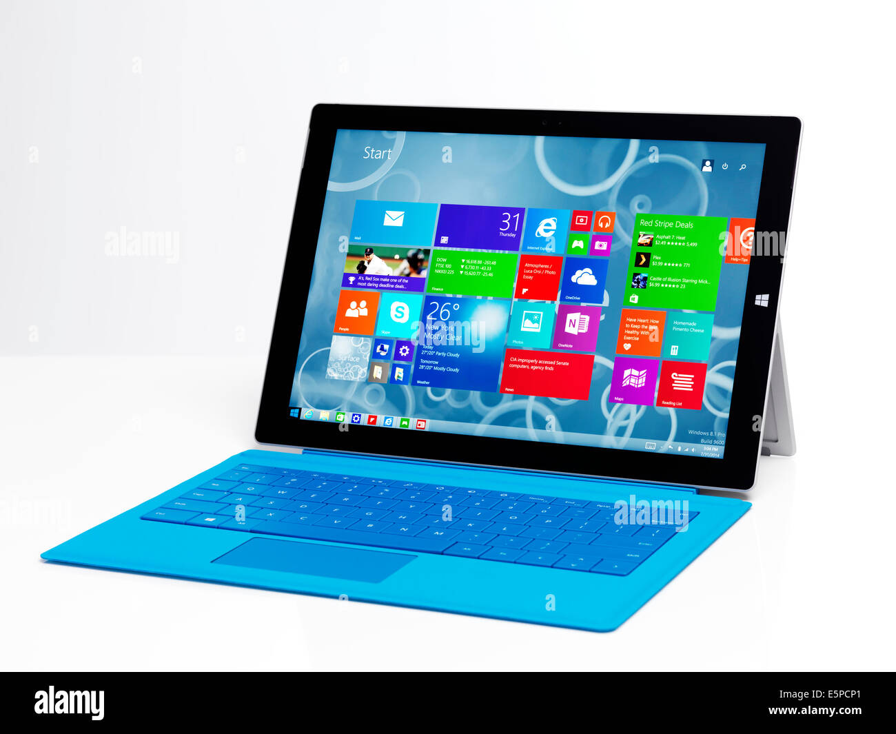 Microsoft Surface Pro 3 tablet computer with a blue keyboard isolated on white background Stock Photo