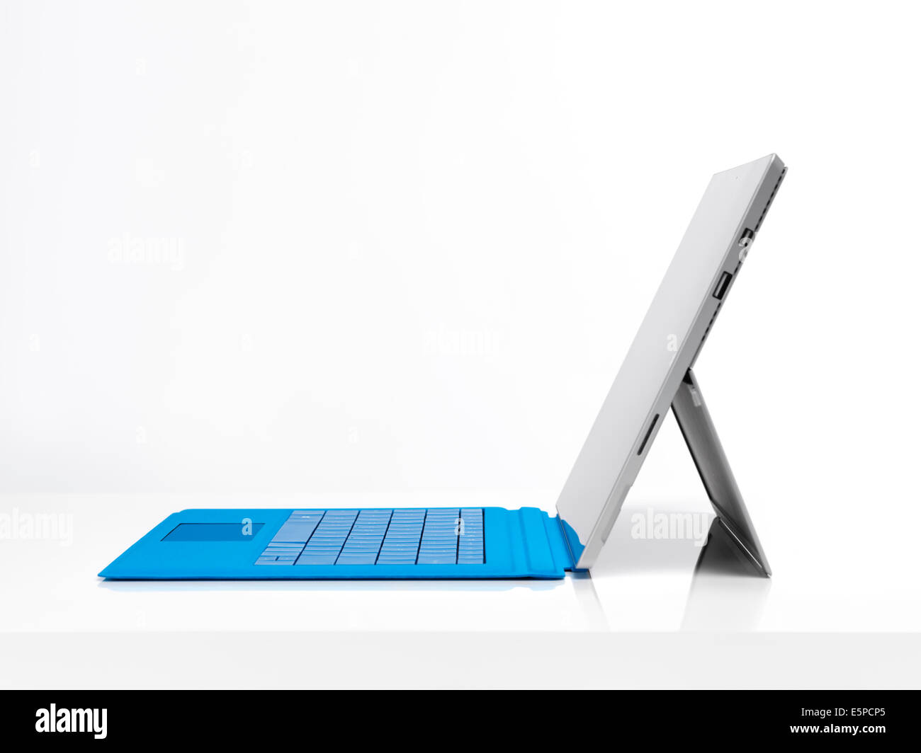 Microsoft Surface Pro 3 tablet computer with a blue keyboard side view  isolated on white background Stock Photo - Alamy