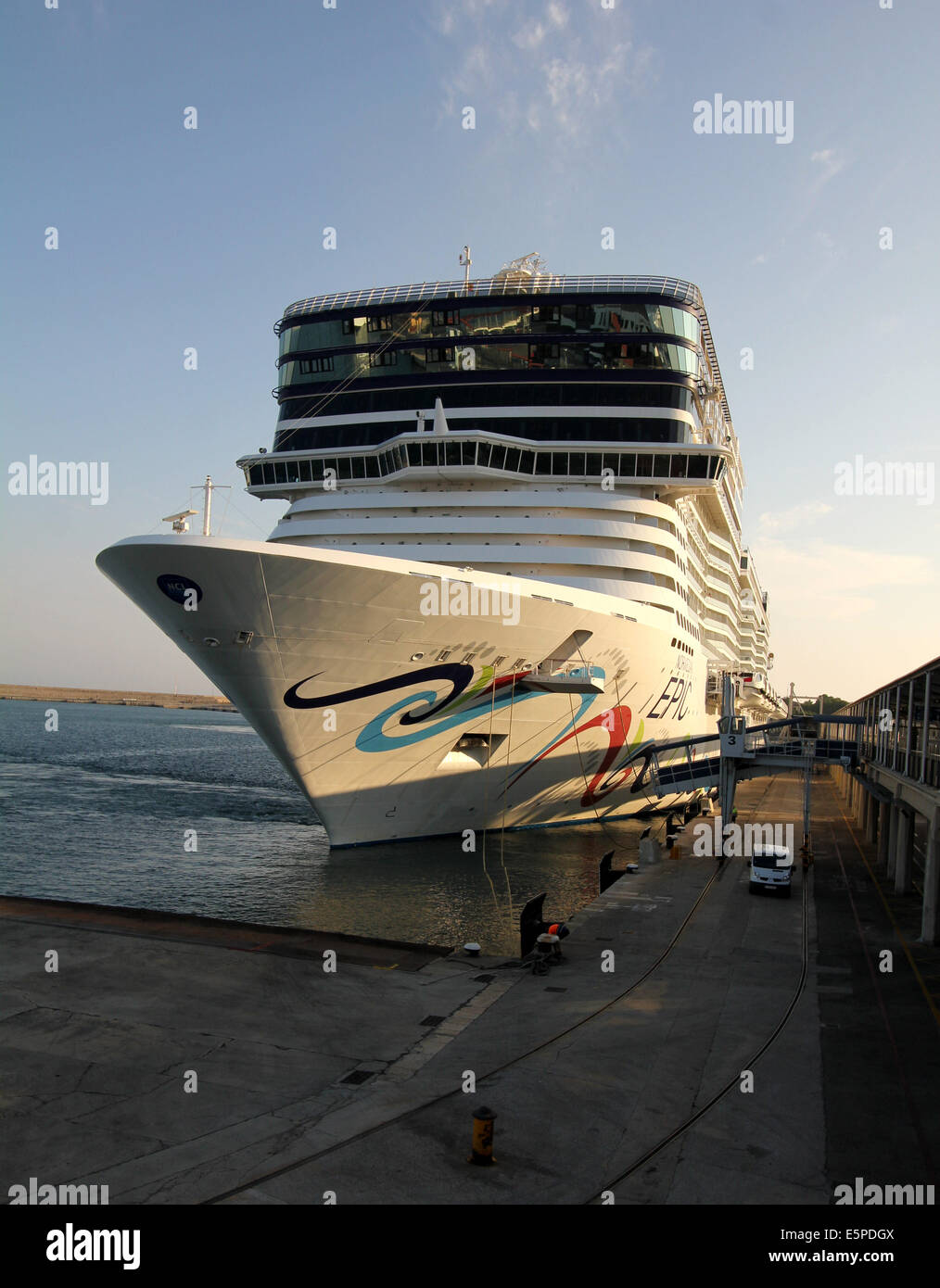 Norwegian Cruise Line (NCL) Cruise ship “Norwegian Epic” (325 mtrs) - casting off mooring lines during early evening departure Stock Photo
