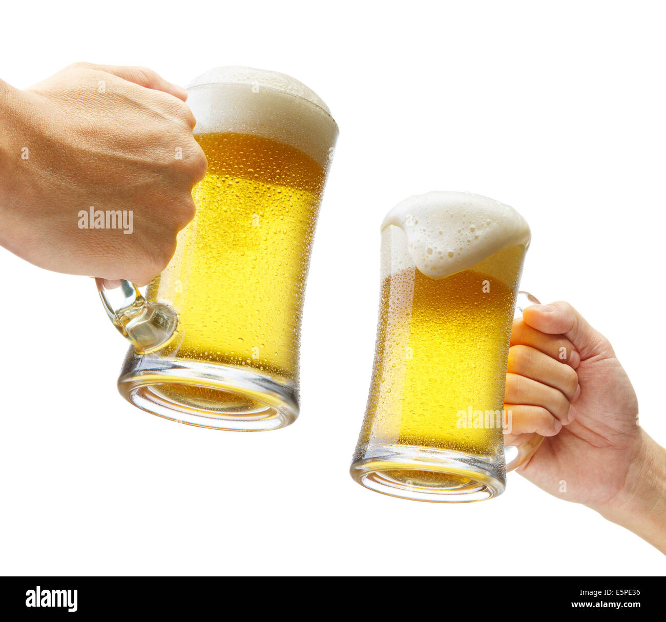 two hands holding beers making a toast Stock Photo
