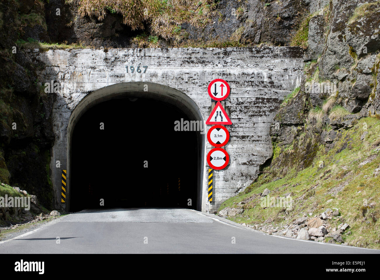Exit of a single-track tunnel between Ánir and Árnafjørður, Borðoy, Faroe Islands, Denmark Stock Photo